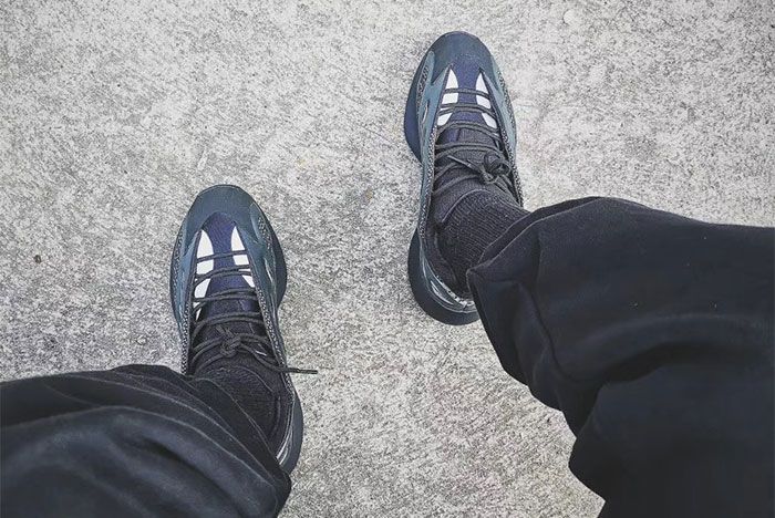 black yeezys on feet
