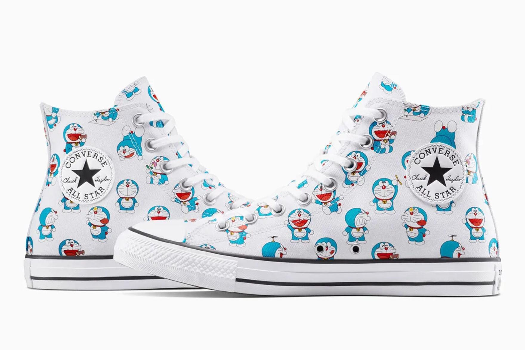 Blue and white converse sneakers covered with cartoon cat print