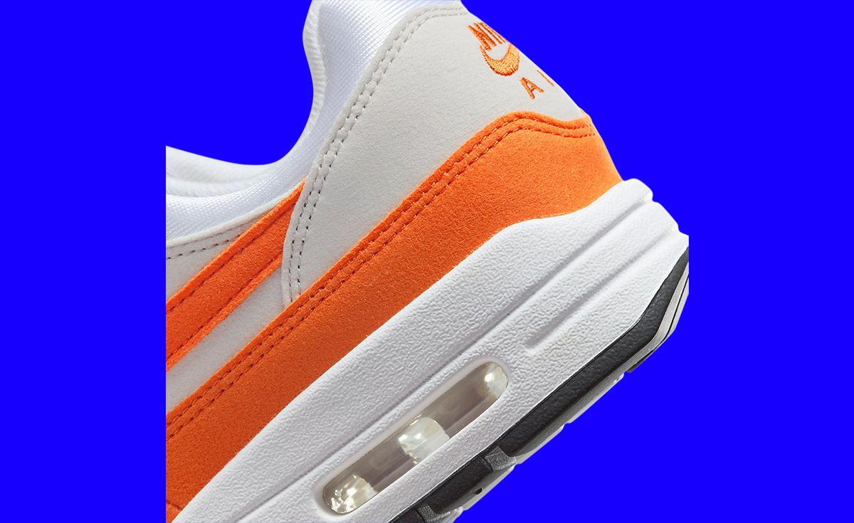 Nike Air Max 1 sneakers in gray and safety orange