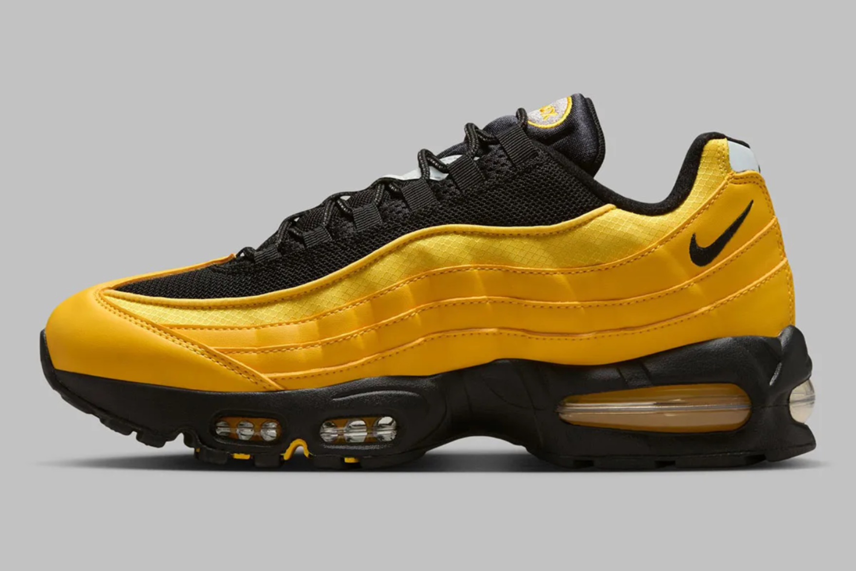 yellow and black coloured nike air max 95 sneaker