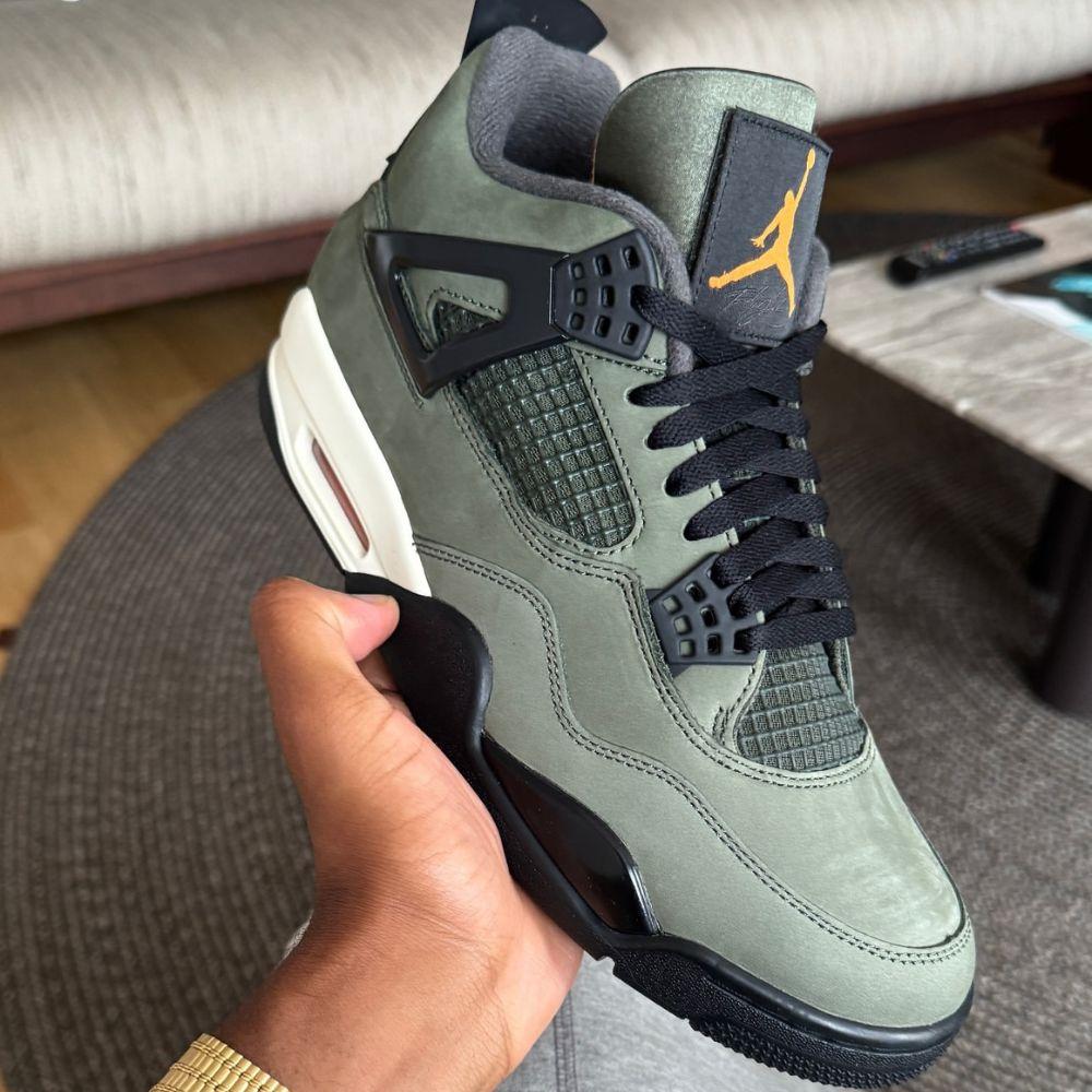 Undefeated x Air Jordan 4 in Hand of Clint Corteiz Founder