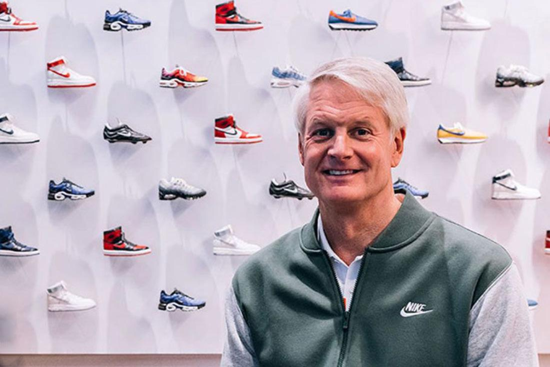 John Donahoe sitting in a green nike gilet