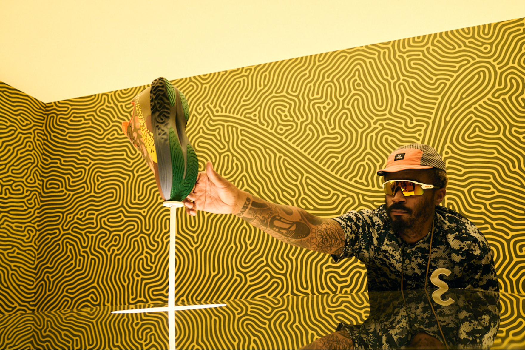 salehe reaching out to touch a sneaker