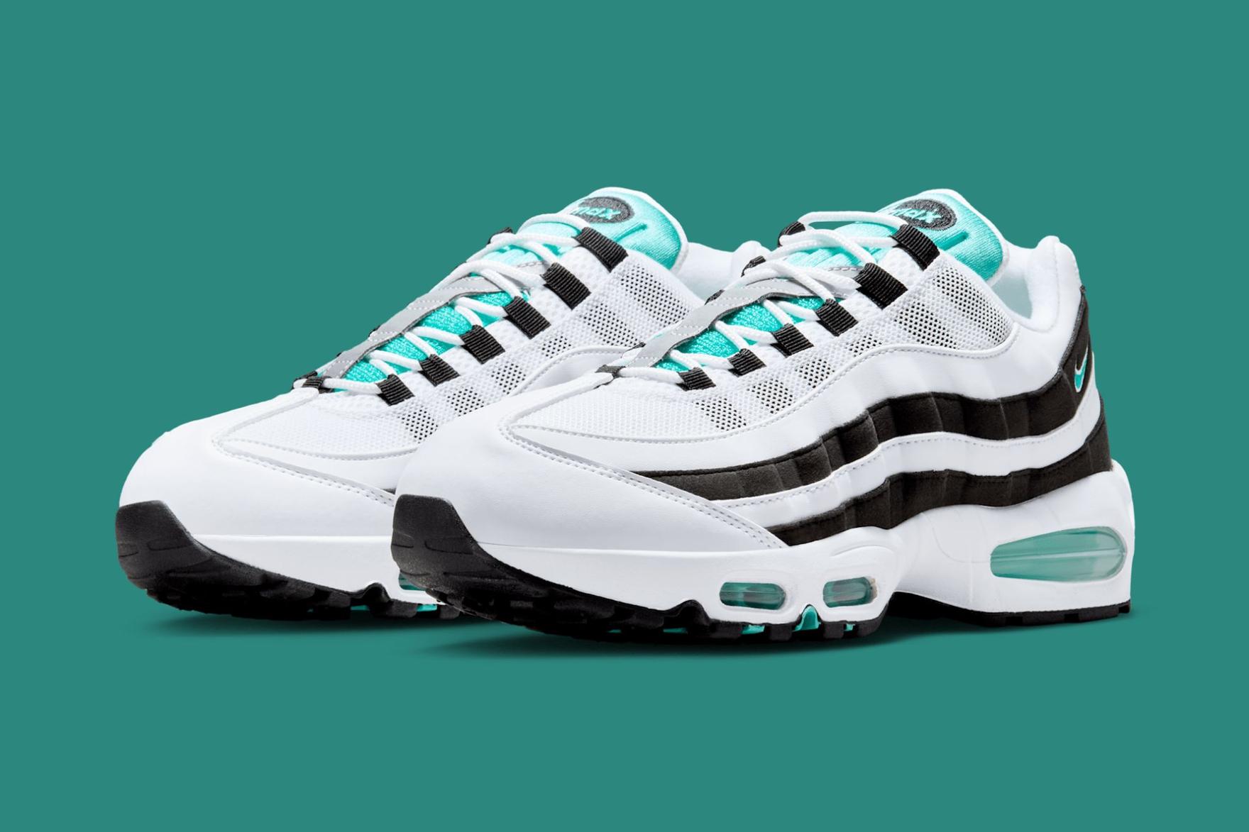 black white and green sneaker on a teal-coloured background