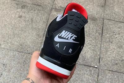 Air Jordan 4 Bred In Hand Up Close Right Nike Air Back