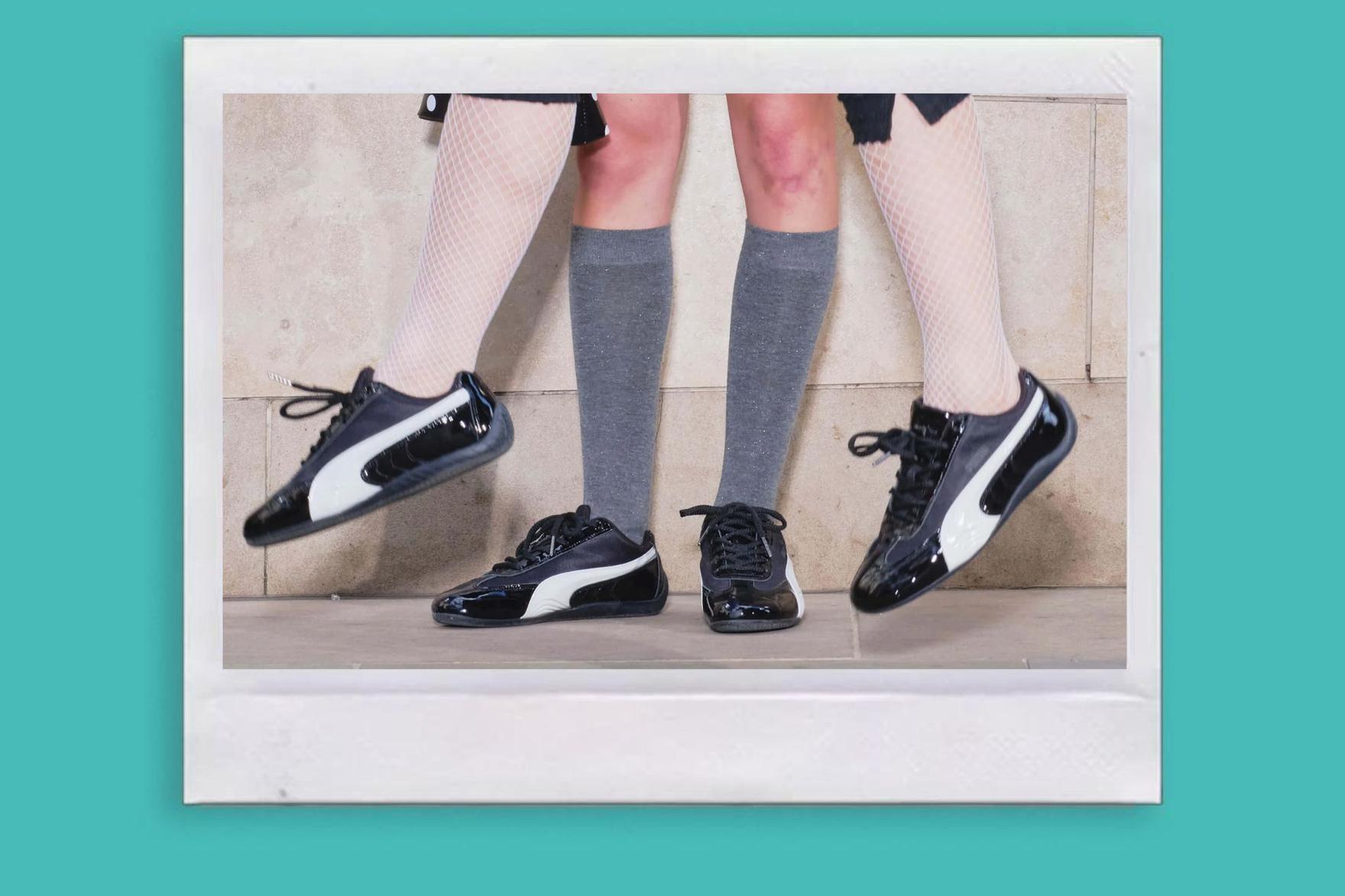 Two people wearing shiny black sneakers with socks