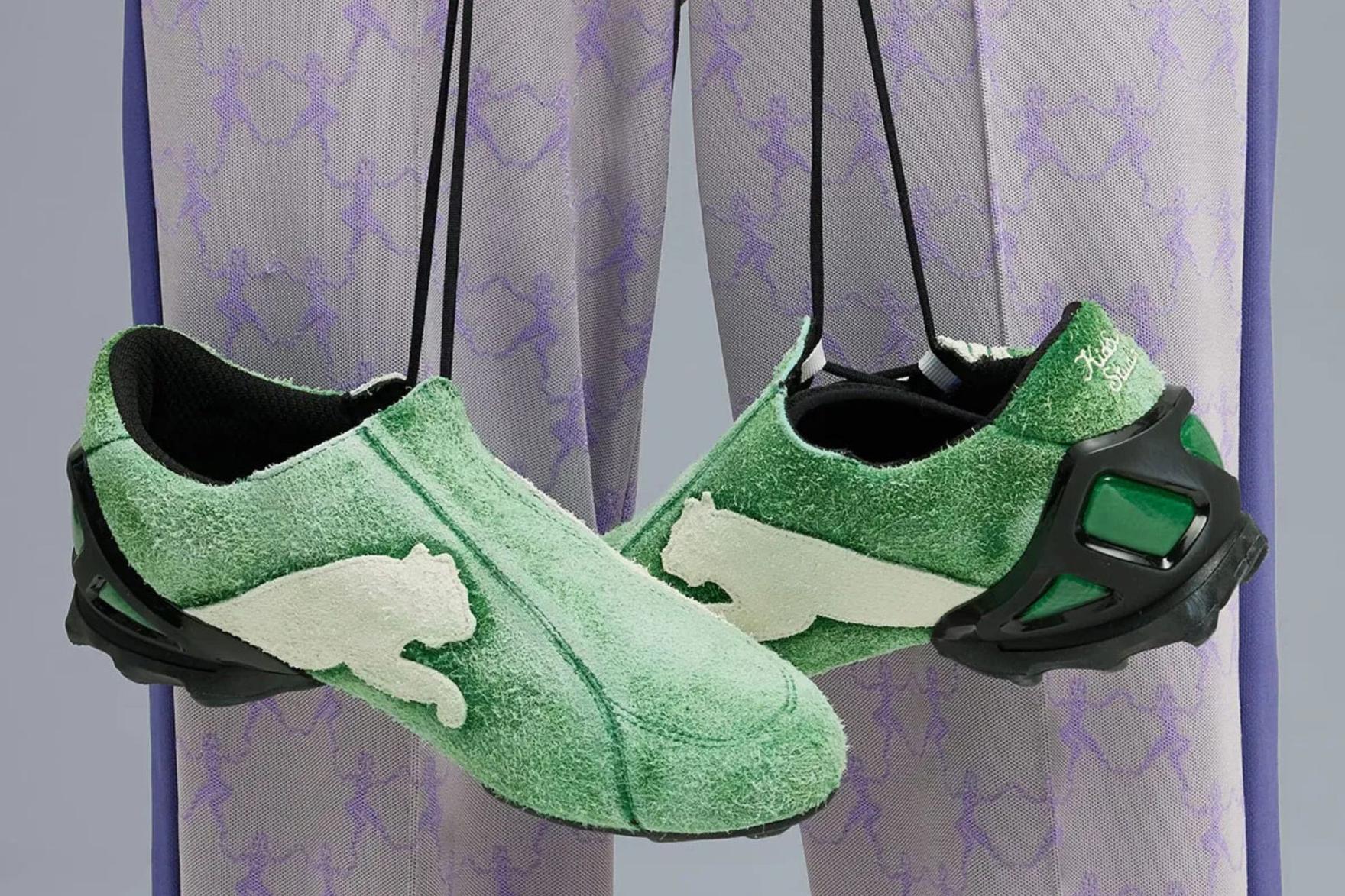 Green and cream suede PUMA football sneakers against purple lace
