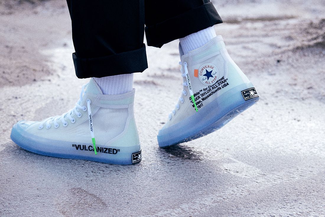 off white converse on feet