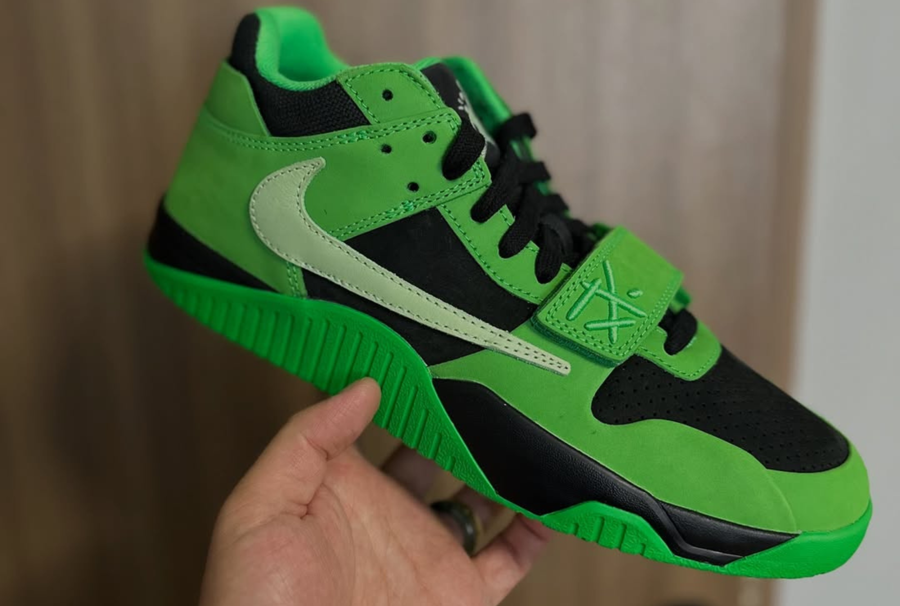 green jordan jumpman sneaker in-hand shot