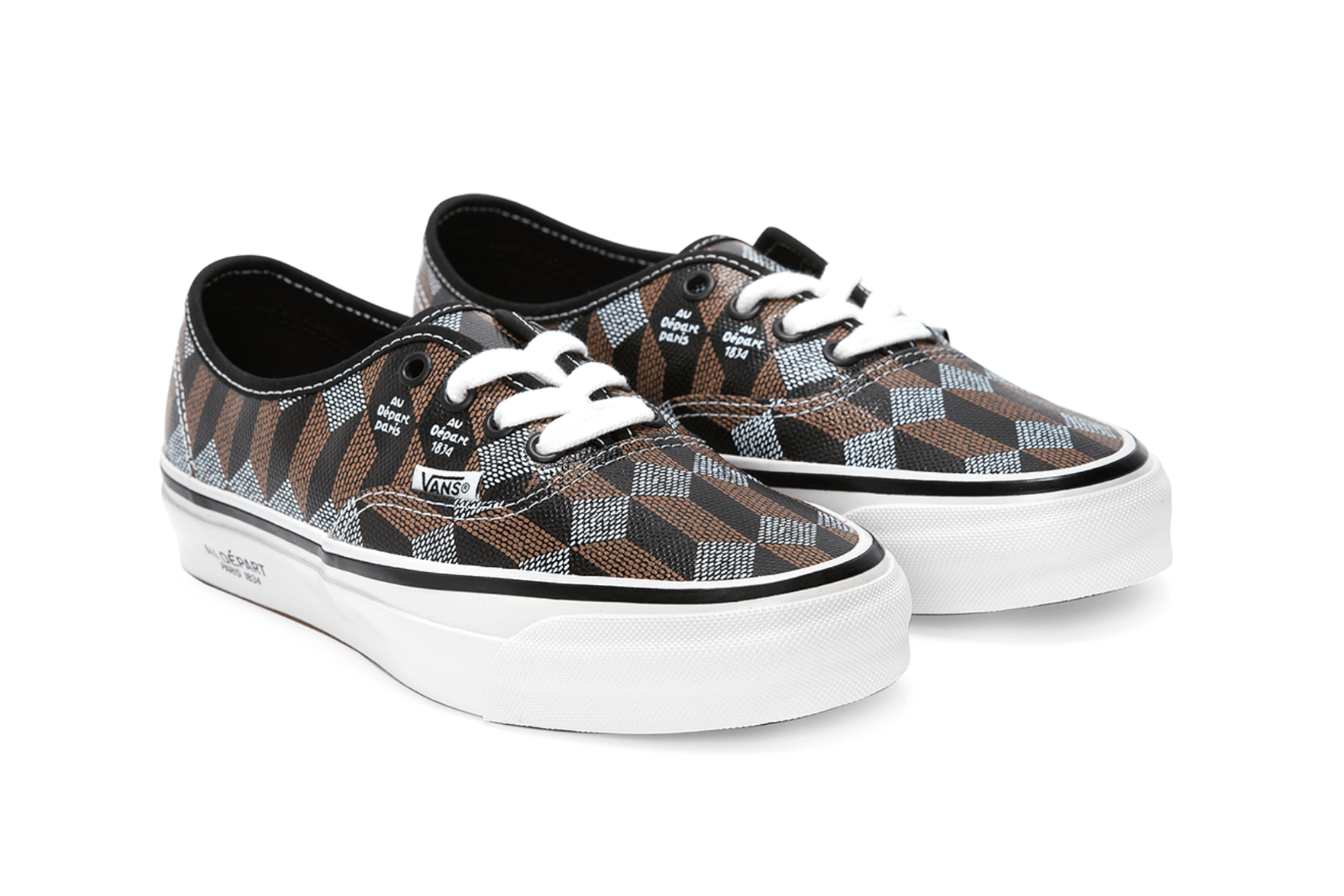 a pair of black white and brown vans on a white background