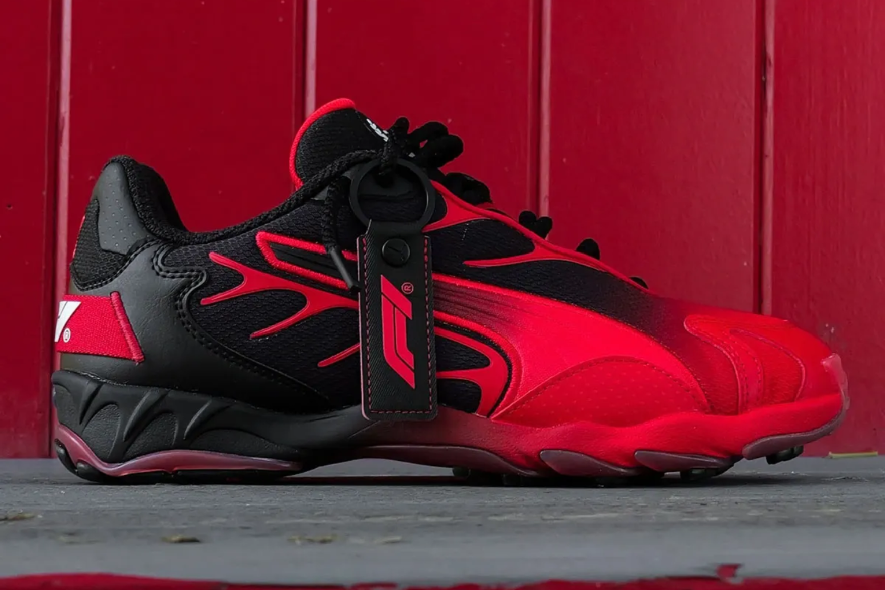 red and black gradient puma inhale sneaker on red background
