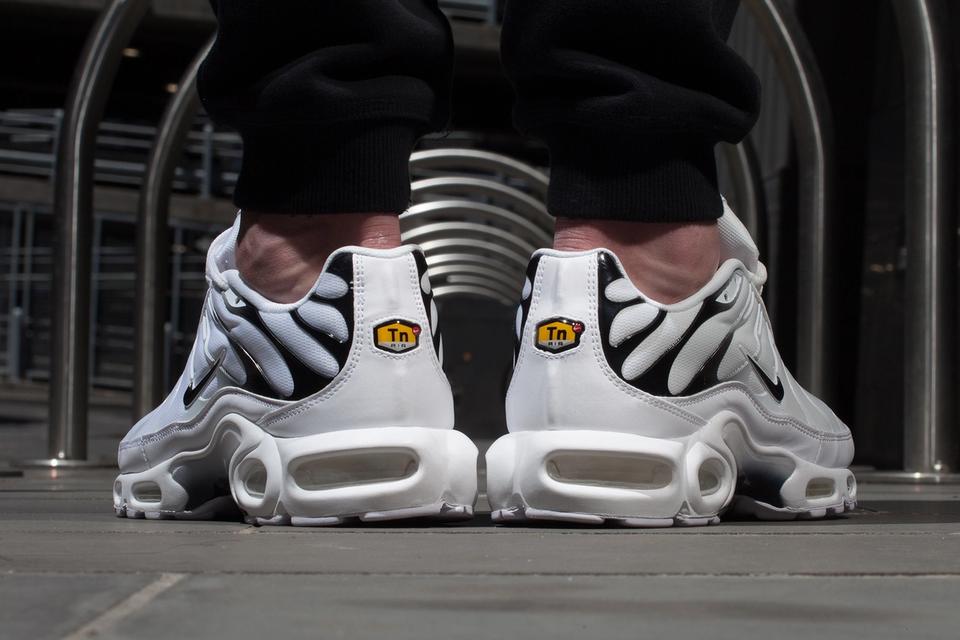 white and black air max plus