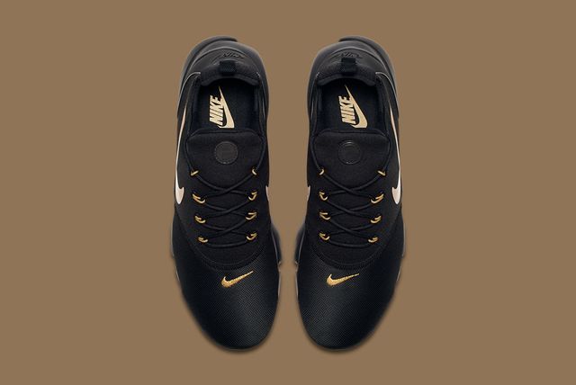 black and gold nike slippers