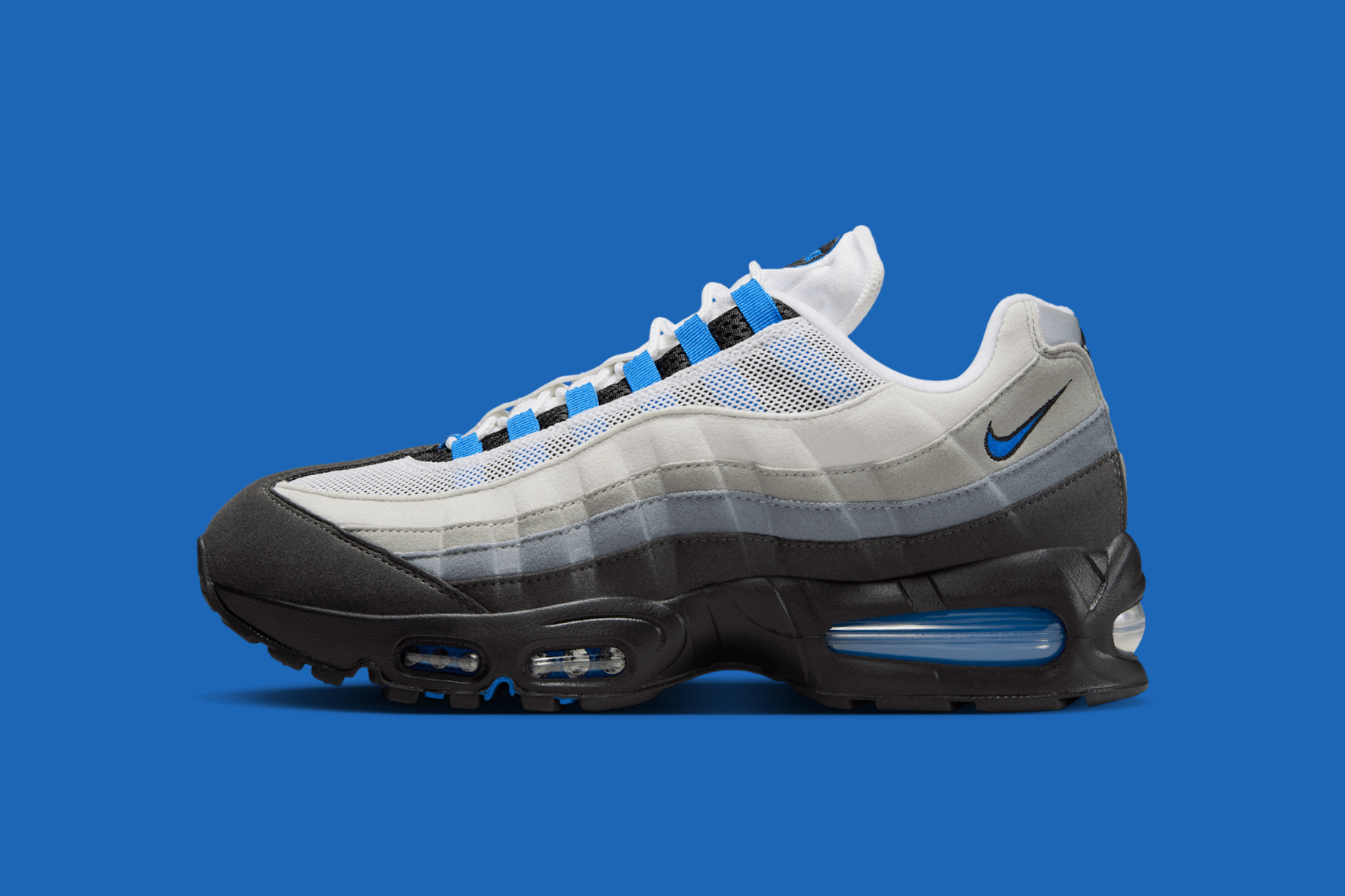 Blue white and grey sneakers on a blue background