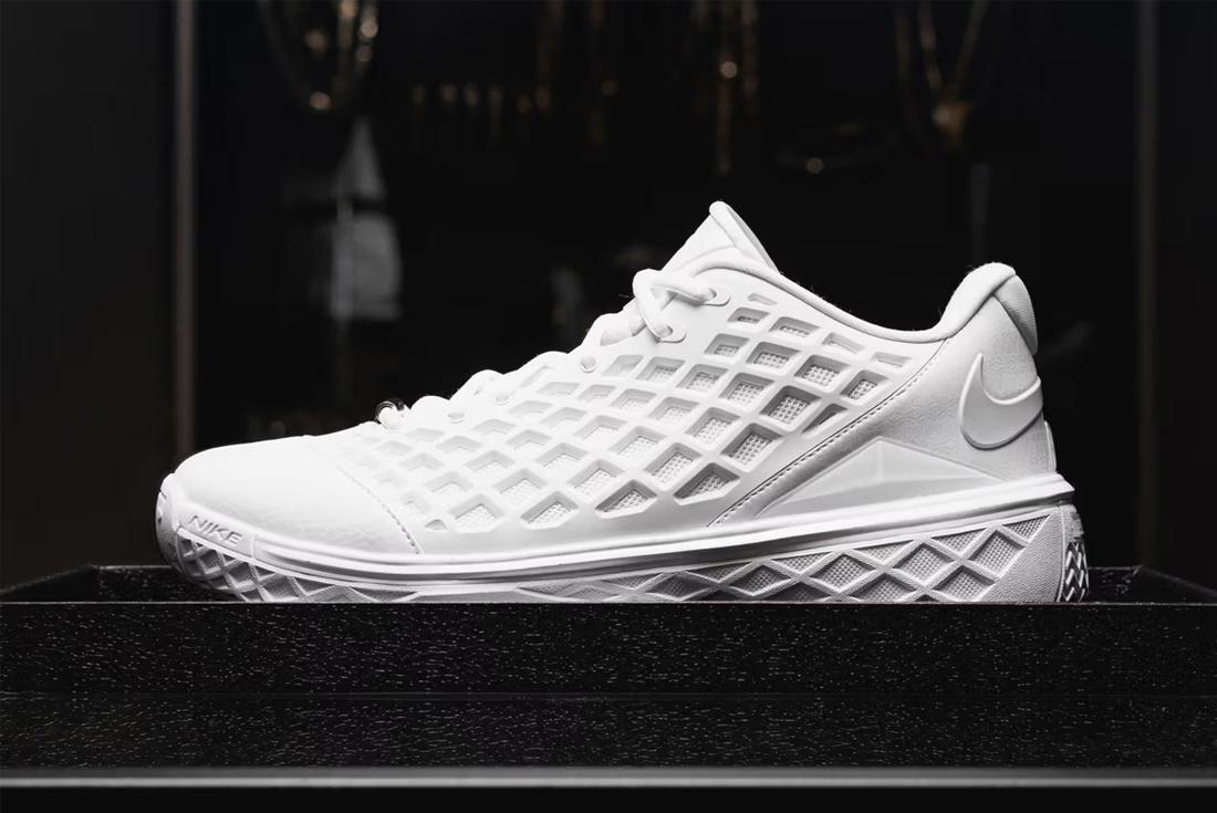 White nike kobe 3 low protro sneaker on black surface