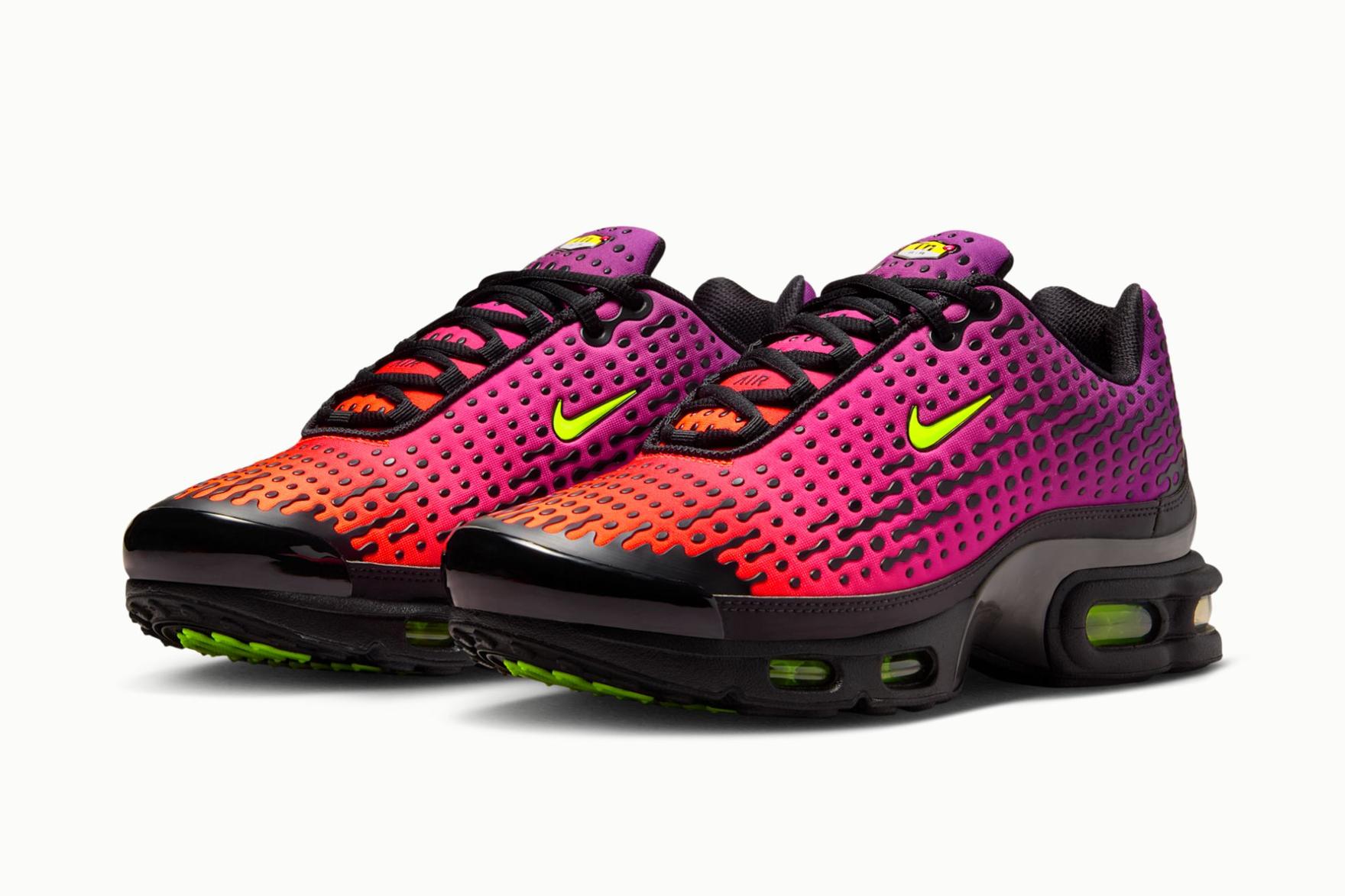 Pink and black Nike sneakers on white background