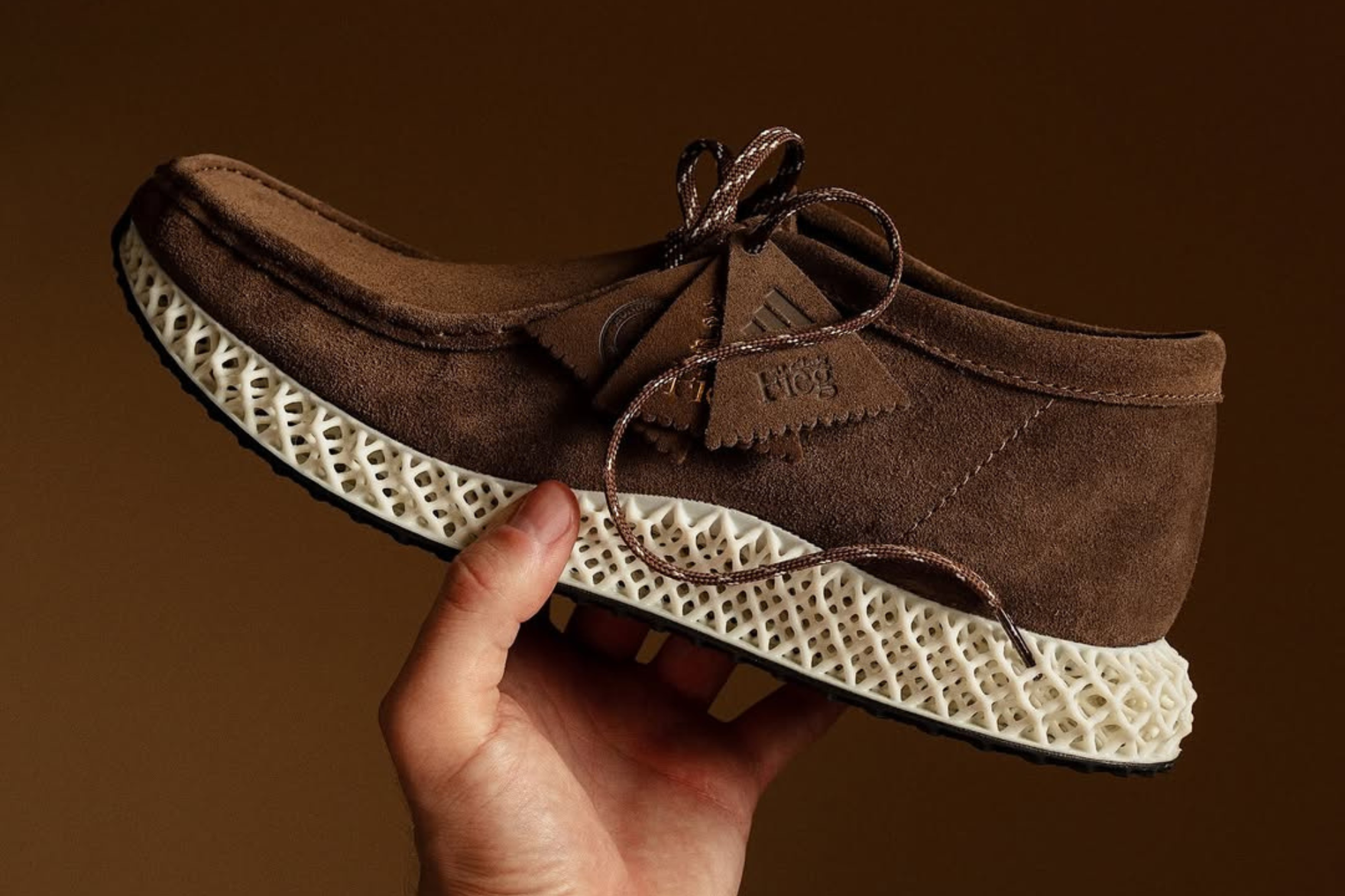 ronnie fieg kith clarks wallabee ultraboost in hand