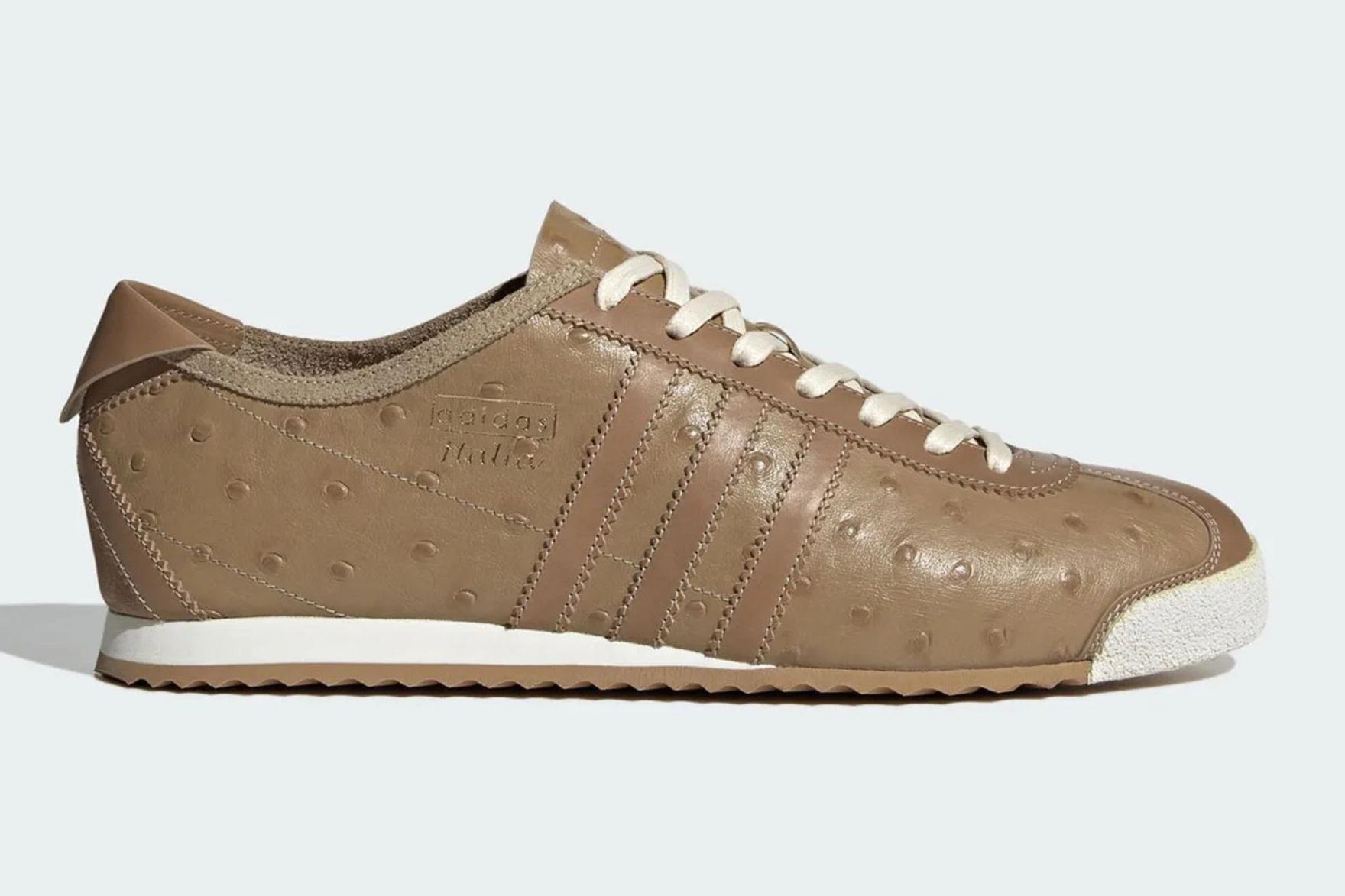 Brown ostrich-leather adidas sneaker on light blue background