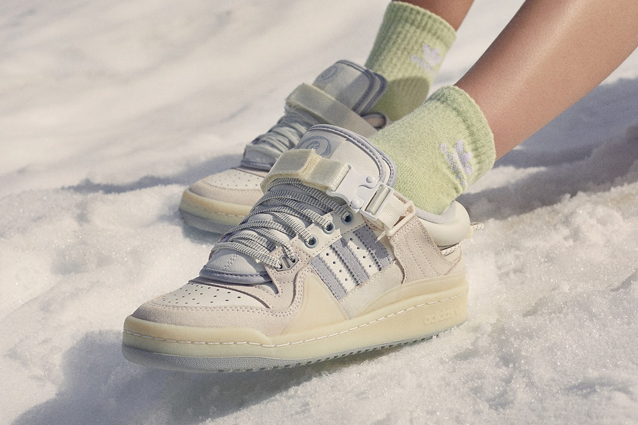 a white adidas forum low sneakers on-foot standing in snow