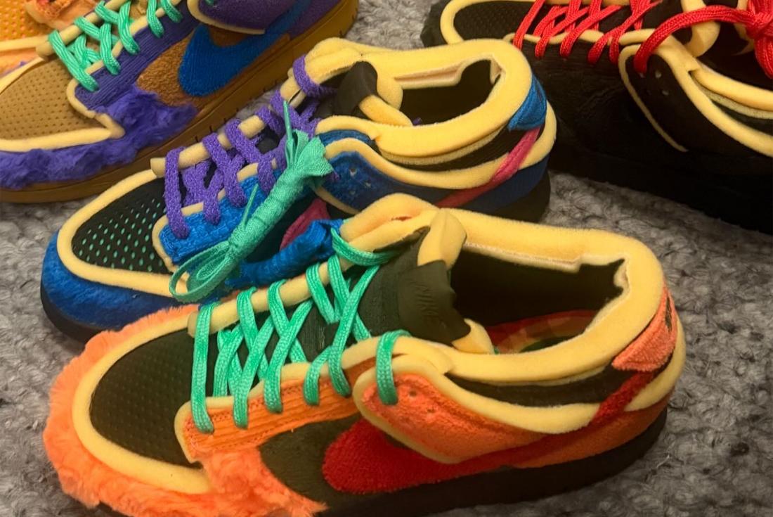 Logos for CPFM and Nike on a rainbow background