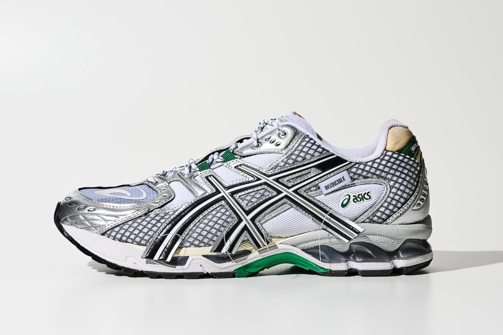 (side profile) asics sneaker with green detailing