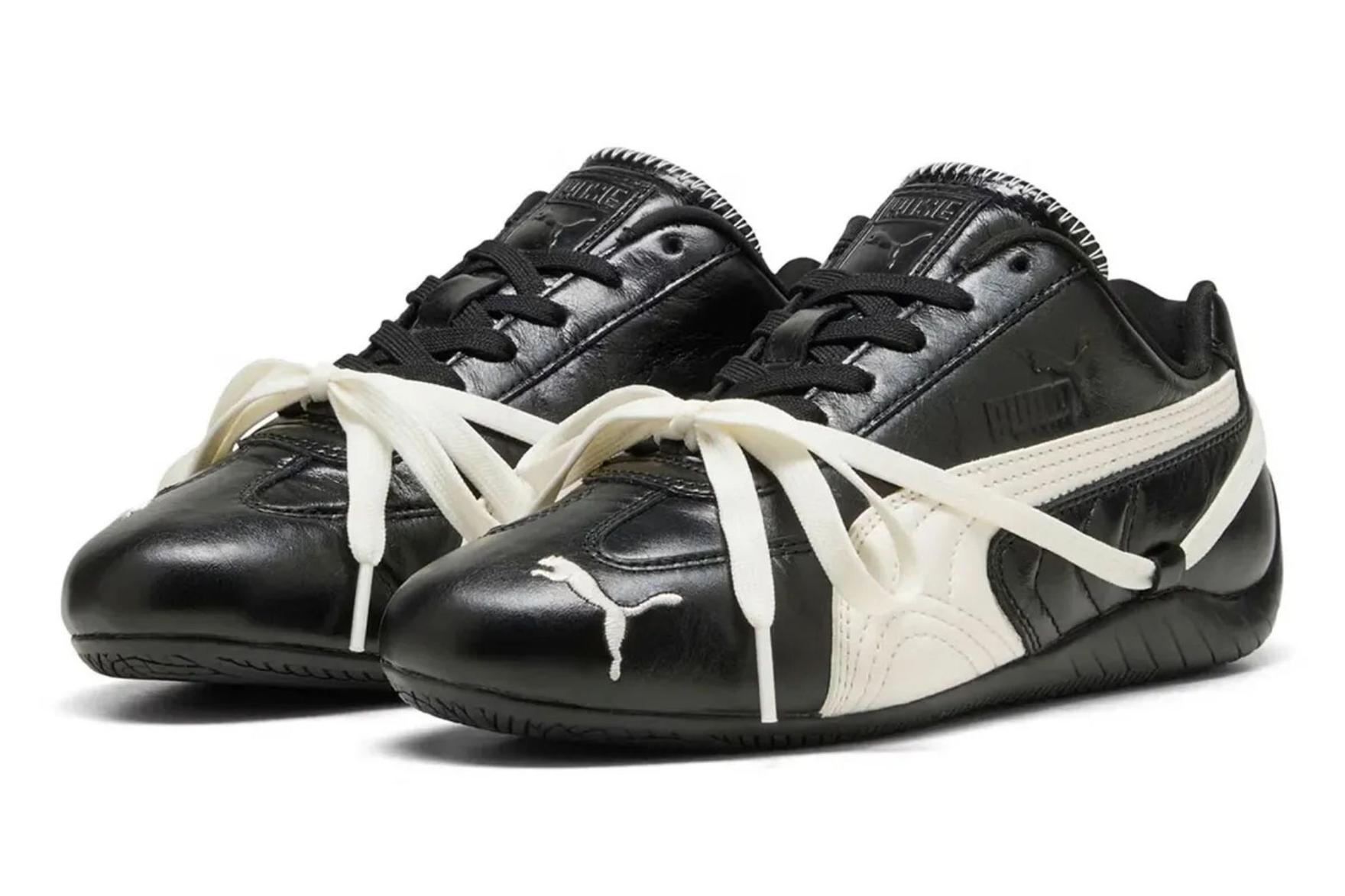 Black and white PUMA sneakers with extra cream laces