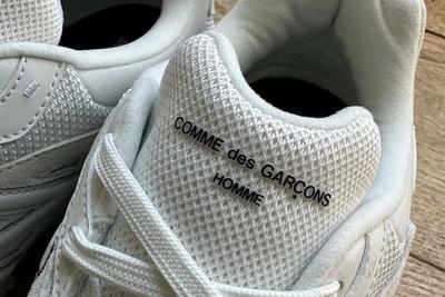 duo rendered in the Japanese brands monochromatic white and black finishing HOMME New Balance 610 White