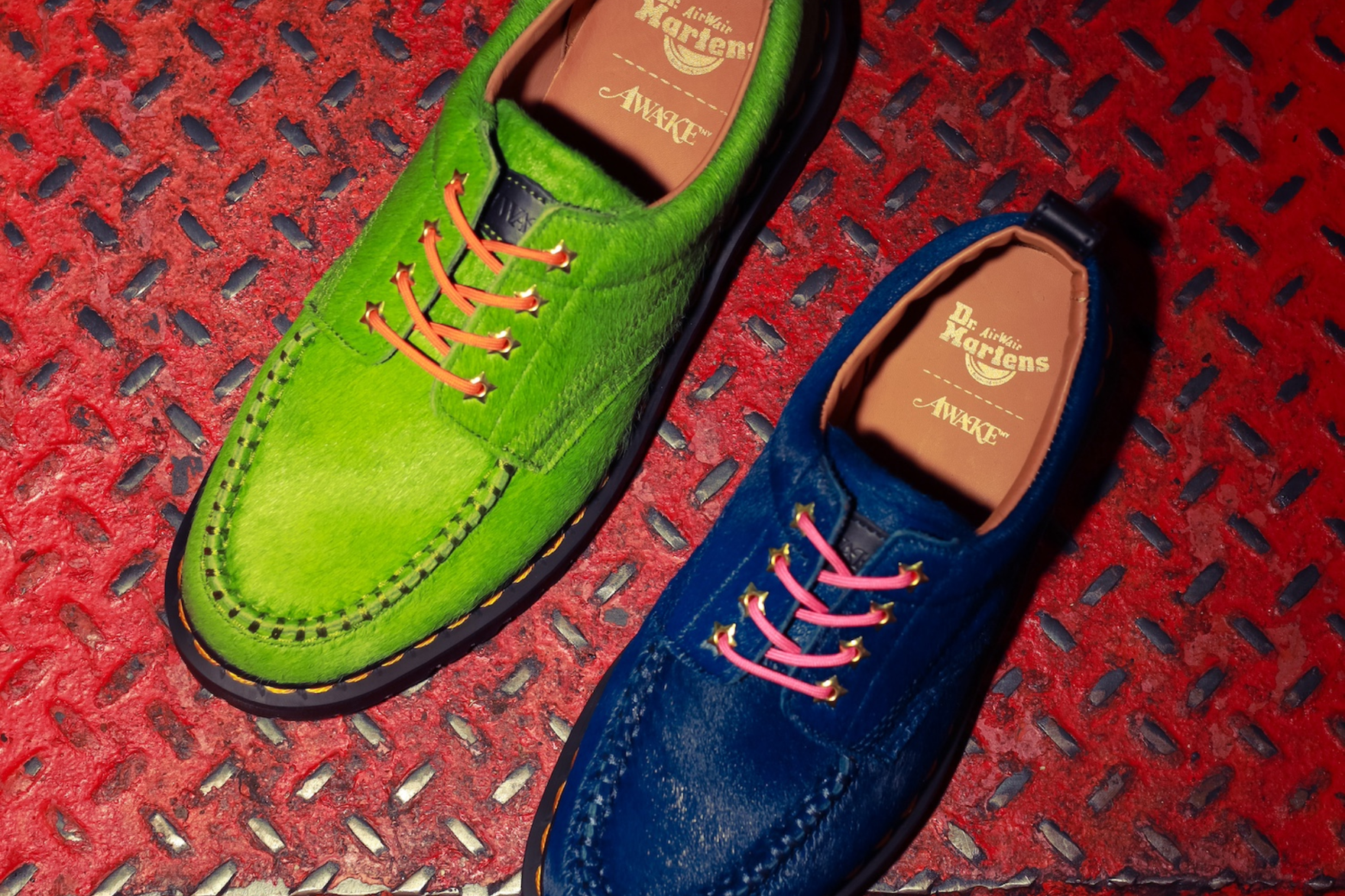 green and blue loafers on red metal surface