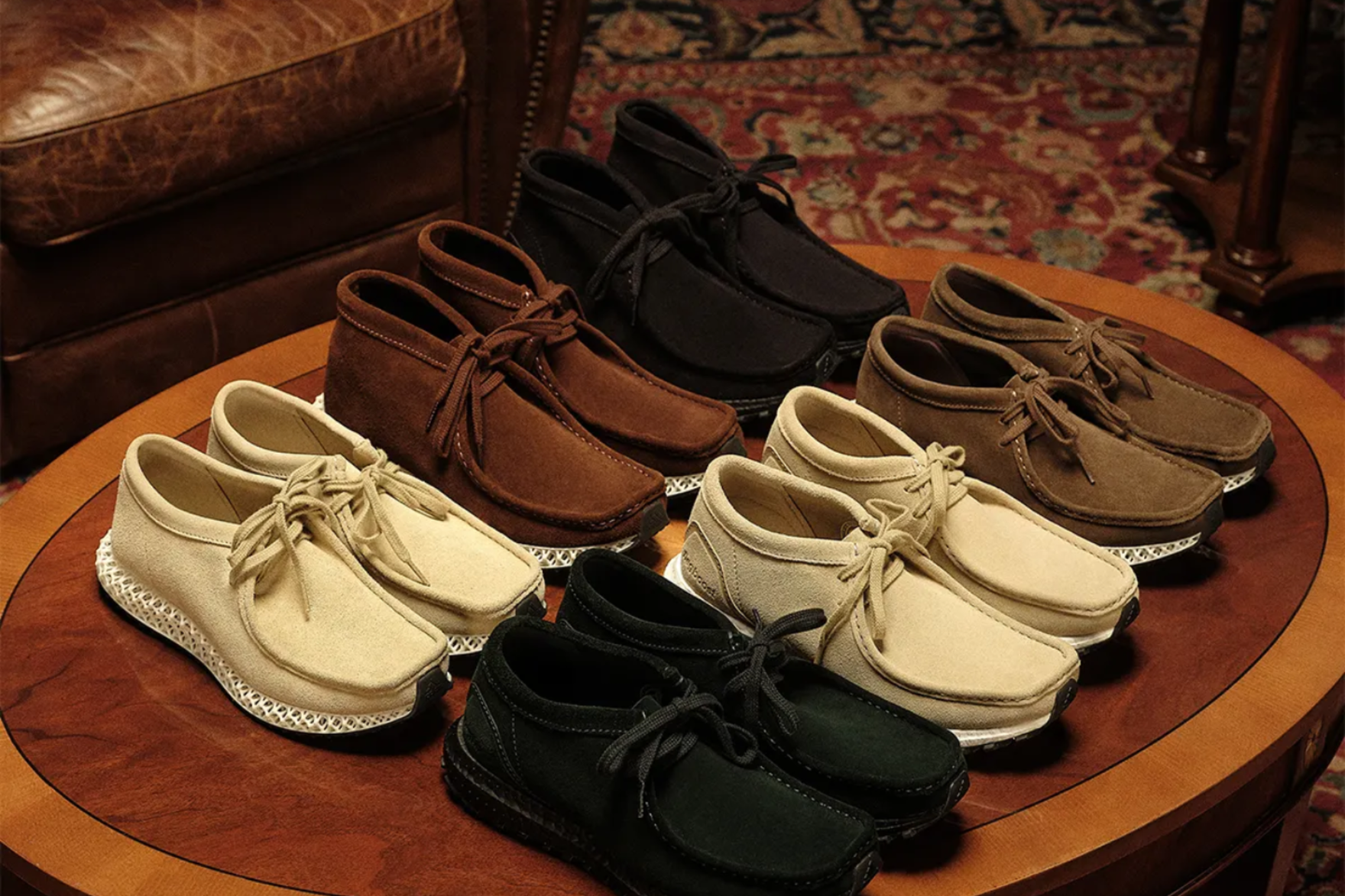 ronnie fieg kith clarks wallabee ultraboost on brown coffee table