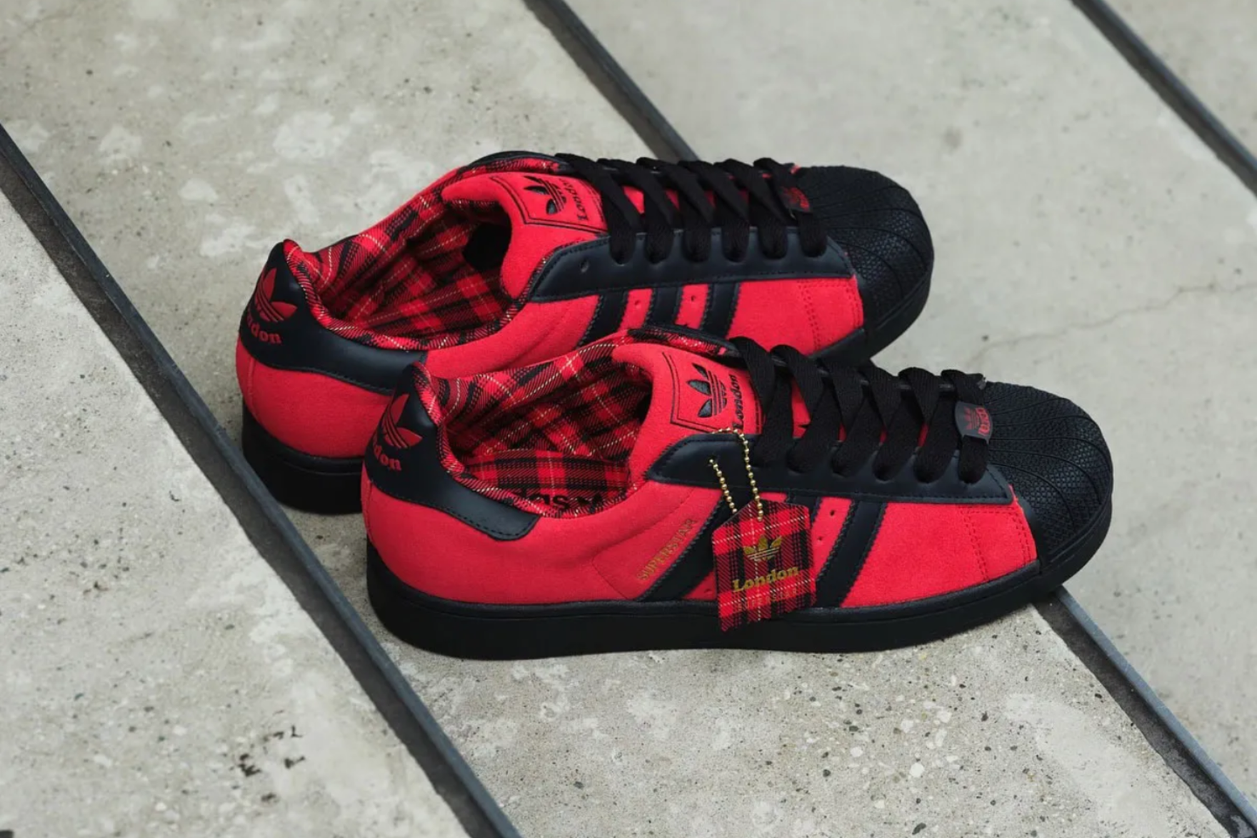 black and red plaid covered adidas superstars