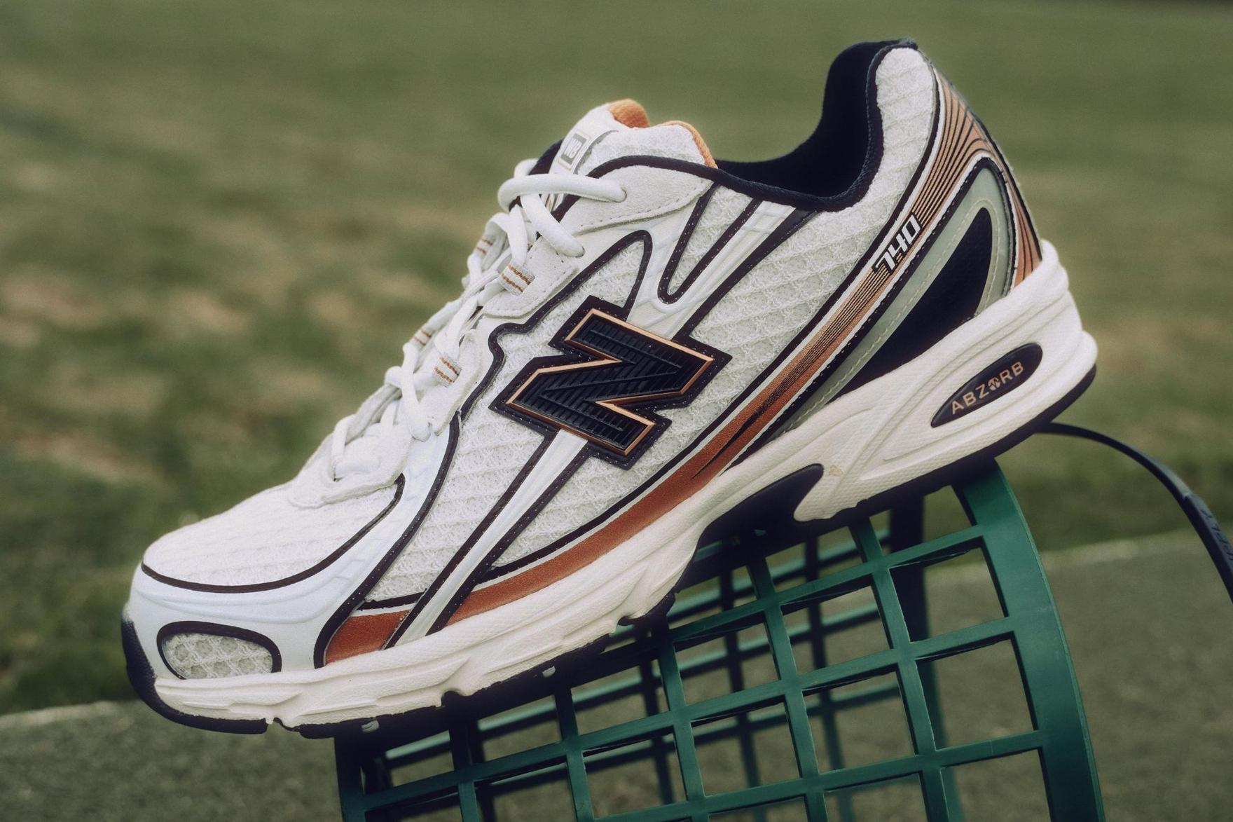 White and silver New Balance golf sneaker sitting on golf green