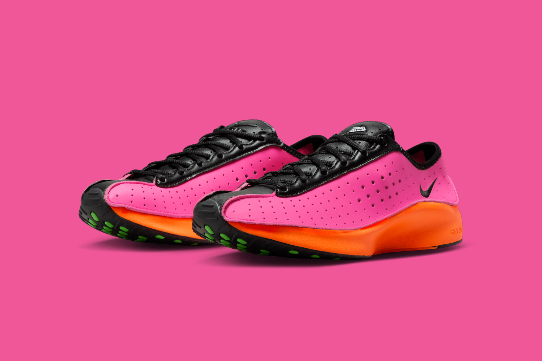 nike superfly sneakers in pink with orange midsole