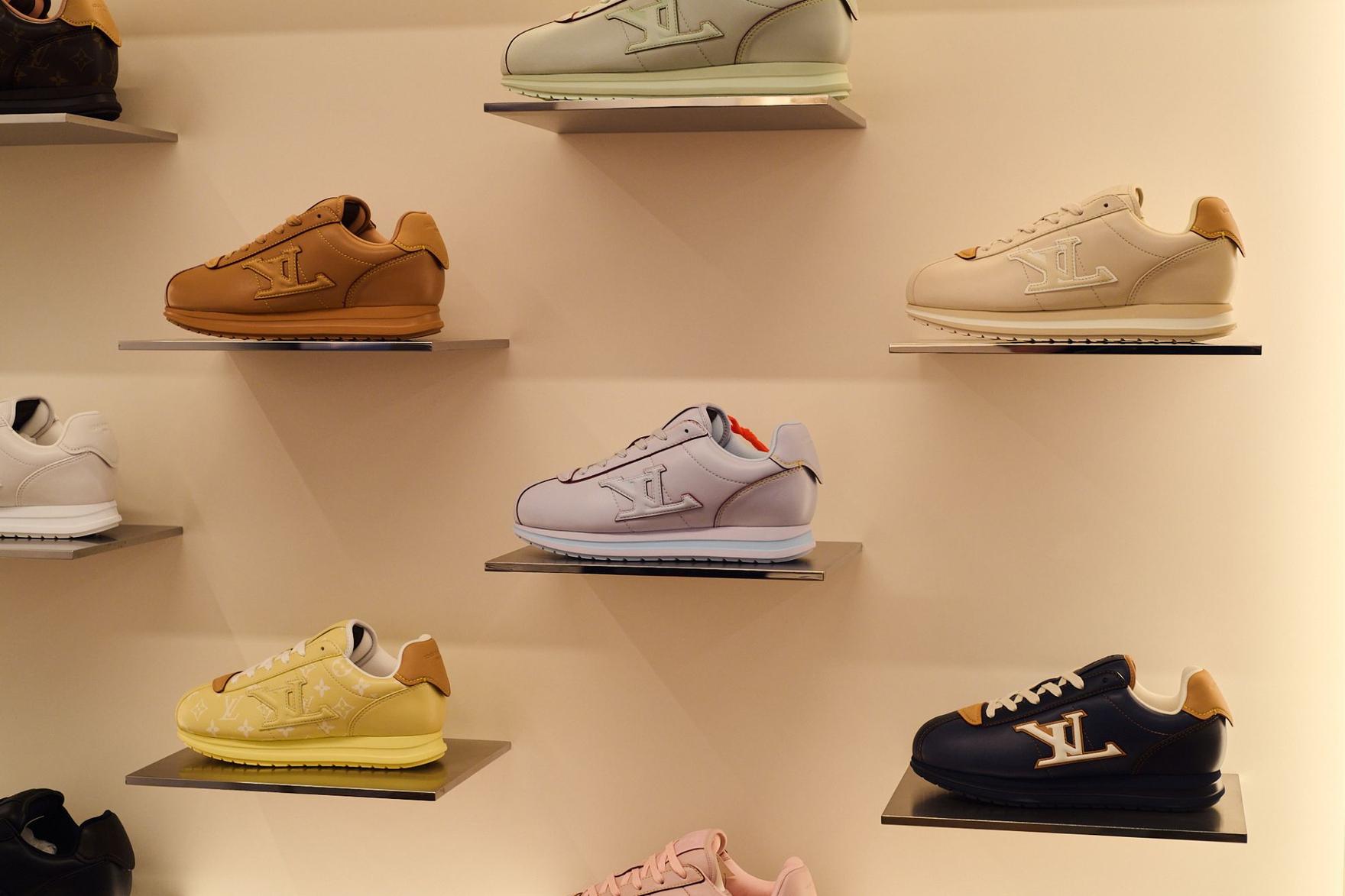 Interior wall featuring Luis Vuitton shoes on display