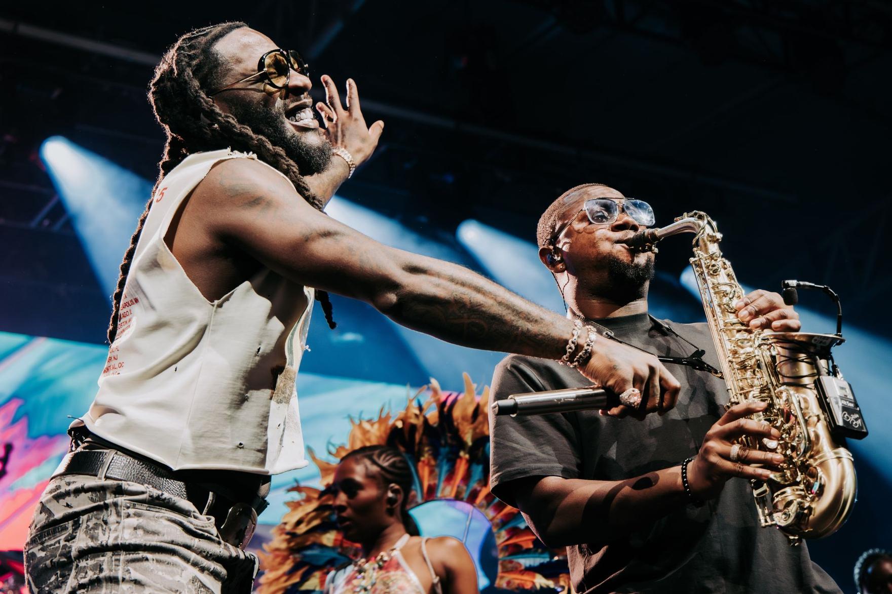 Nigerian rapper Burna Boy on stage in melbourne with saxophonist