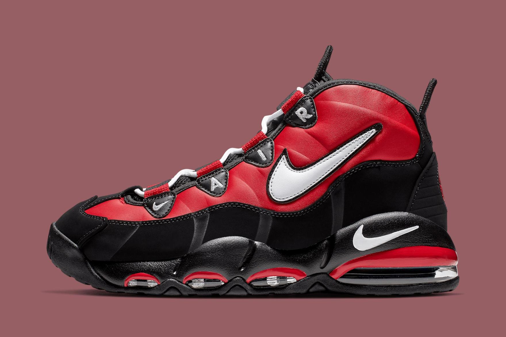 Black, red and white Nike sneaker on plum-coloured background