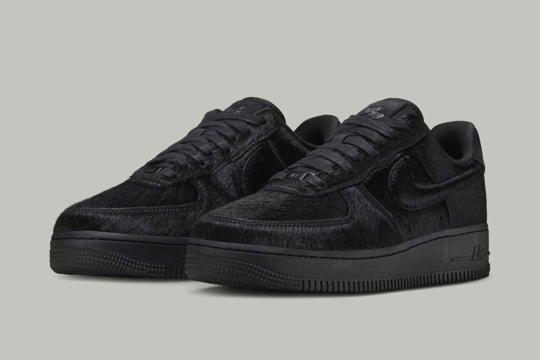 Black pony hair Nike Air Force 1 Low sneakers on grey background