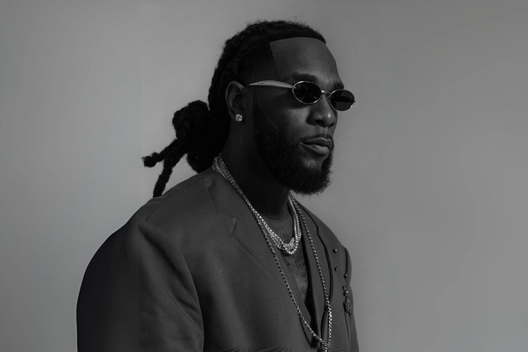 Nigerian rapper Burna Boy in suit jacket and sunglasses