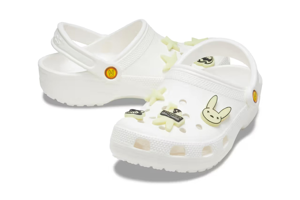 a white croc shoe with rabbit jibbits on a white background