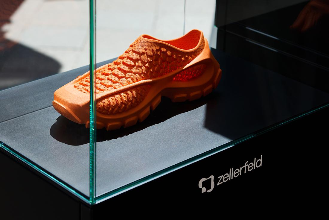 Orange zellerfeld x solebox sneaker in a glass case