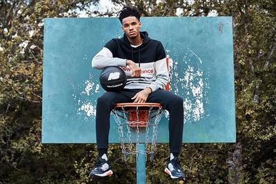 Dejounte Murray Joins New Balance Sitting On Hoop