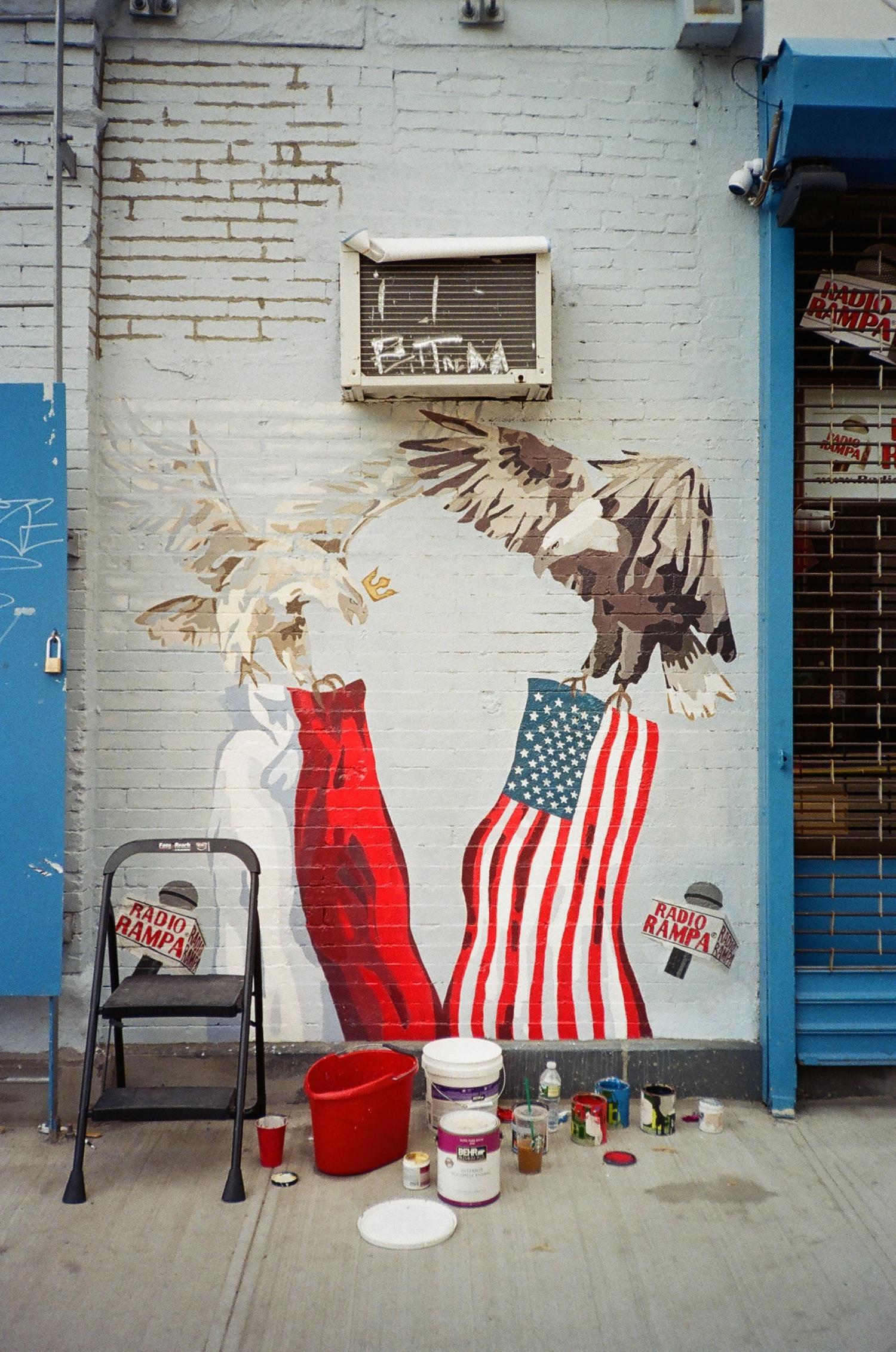 American flag and eagles painted on a building