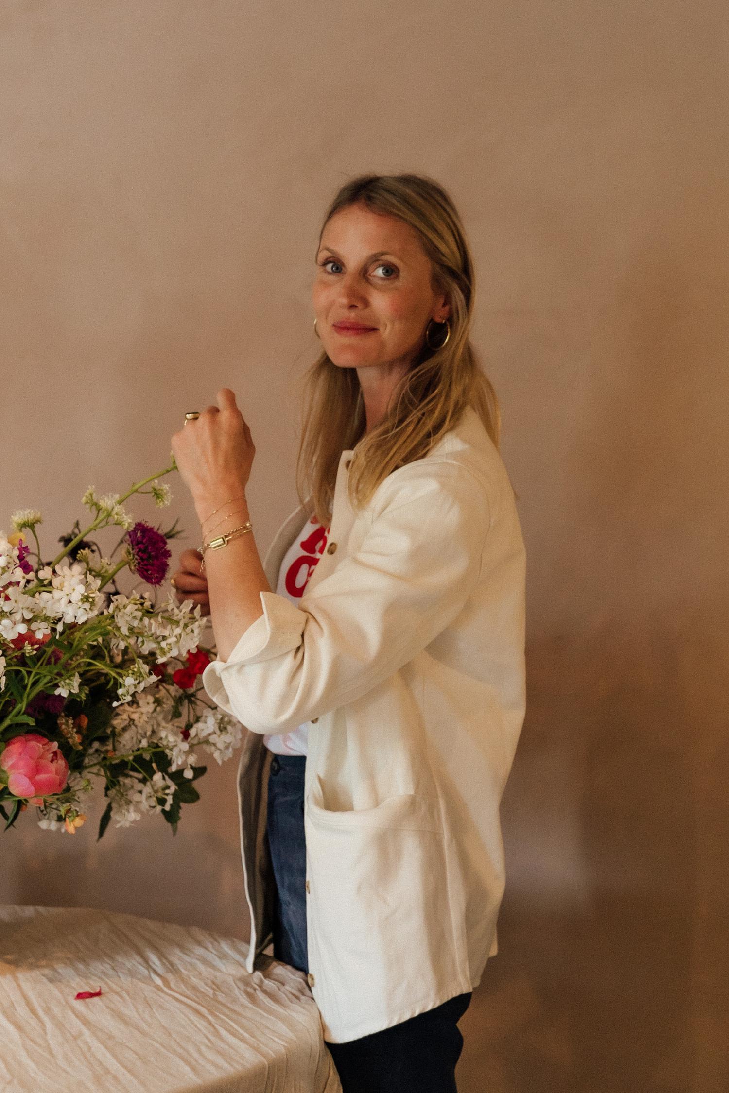Florist, arranging a bunch of hand picked fresh flowers.