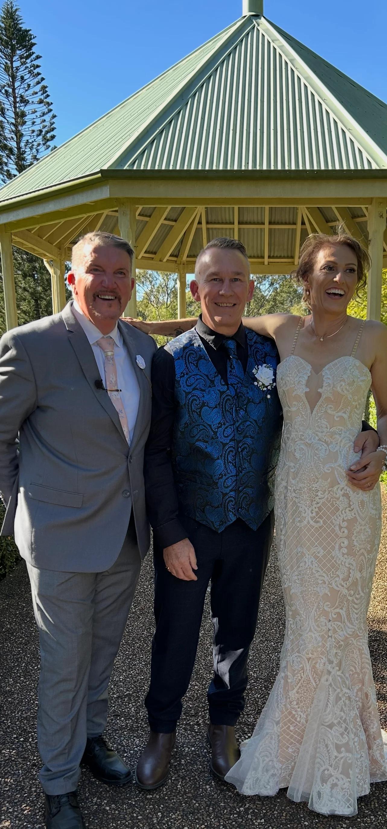Mark sharing a cheerful moment with a couple outdoors