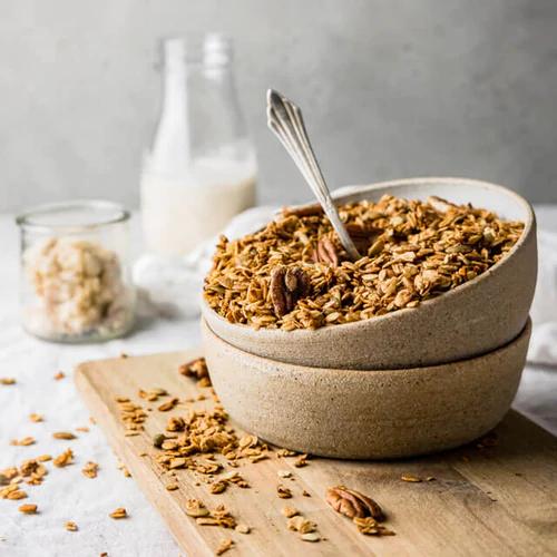 Apple Spiced Granola with Homemade Pecan Pie Milk in a ceramic bowl 