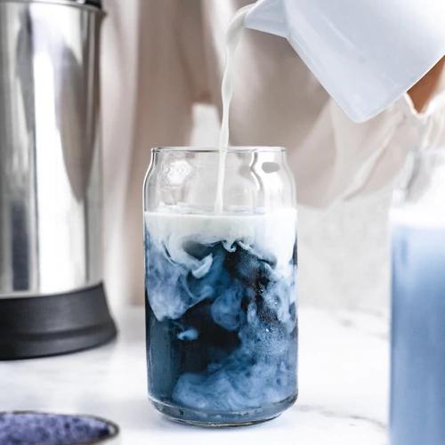 Almond Cow's Iced Blueberry Latte with butterfly pea powder and homemade cashew creamer