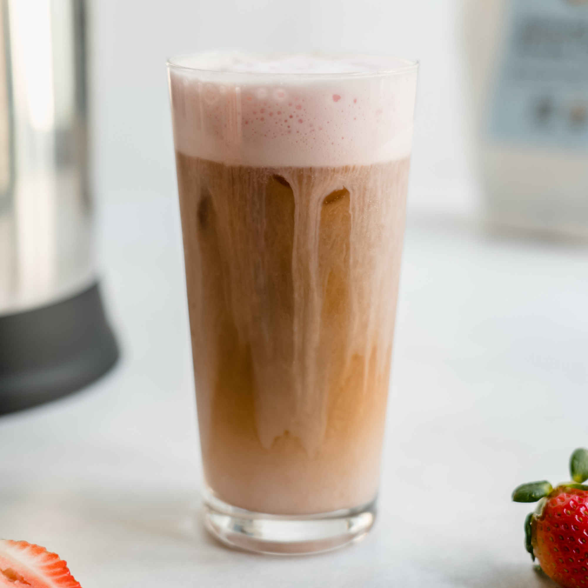 Delicious strawberry cold brew coffee, a refreshing beverage made using Almond Cow almond milk machine