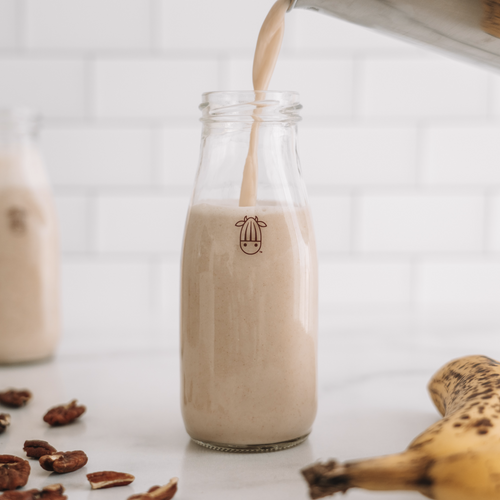 Banana Bread Milk recipe in a glass from Almond Cow
