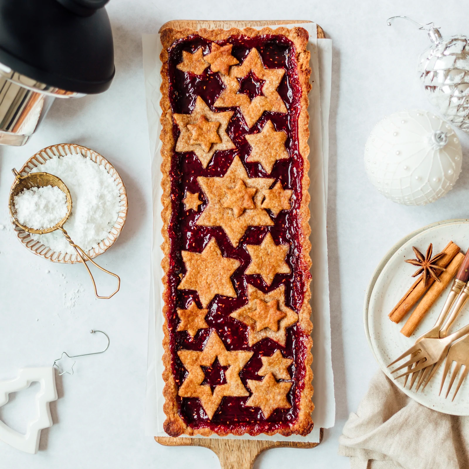 Vegan Linzer tart with festive spiced crust and jam filling by Almond Cow