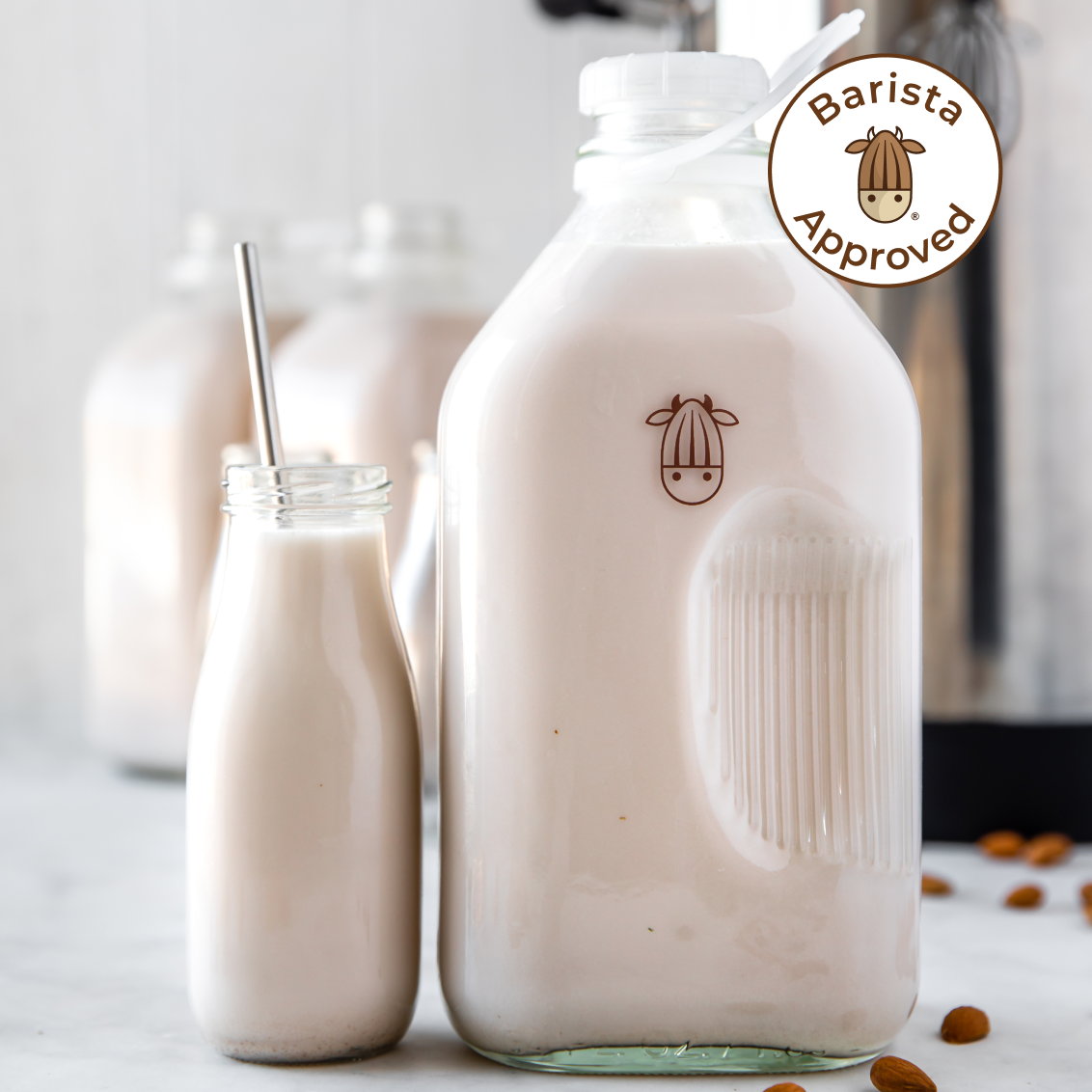 Glass jar filled with fresh Pro Unsweetened Almond Milk from Almond Cow