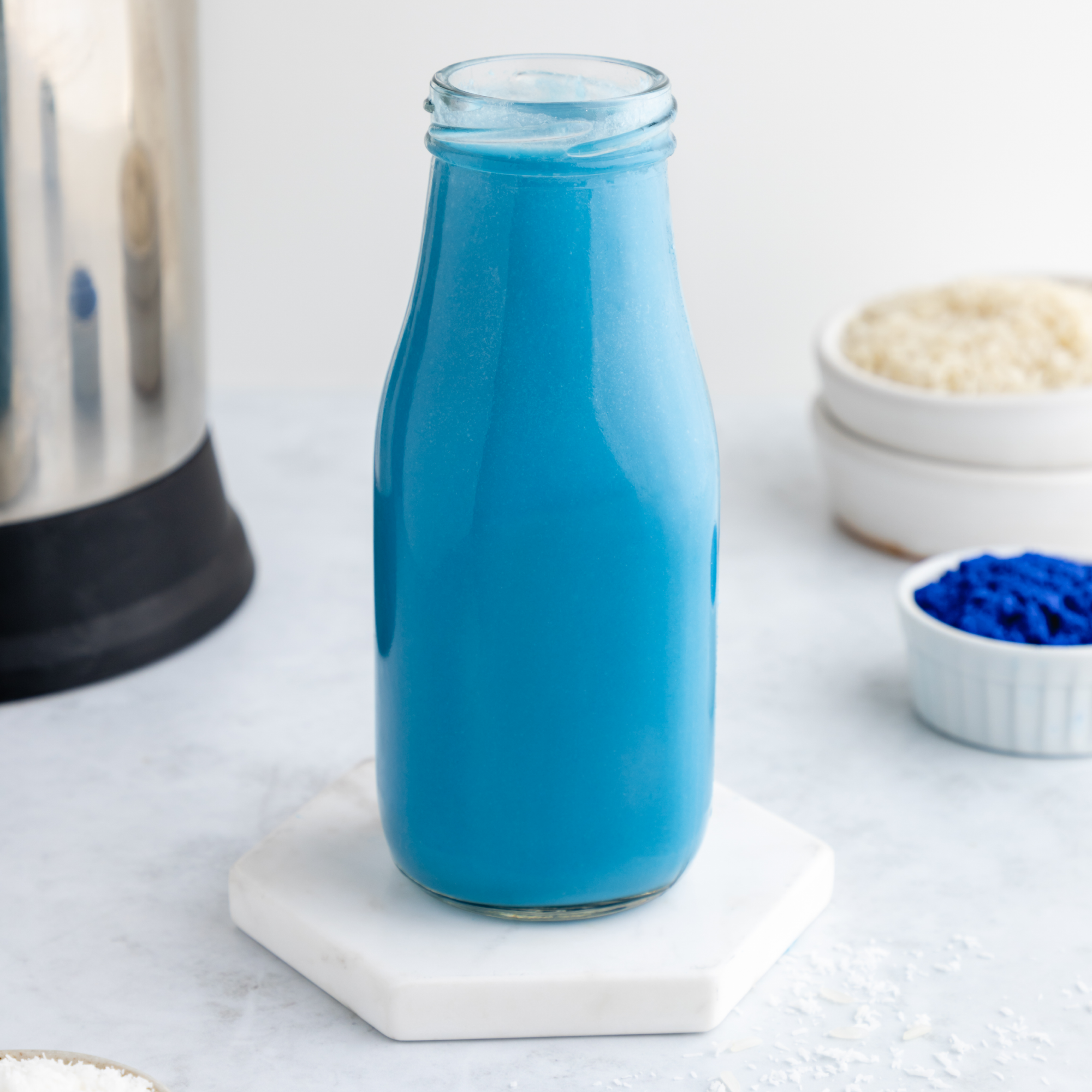 Blue Milk recipe with pineapple, lime, dragon fruit, and blue spirulina for a colorful, delicious, and nutritious beverage